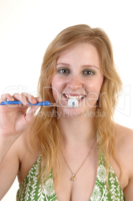 Girl brushing teeth.