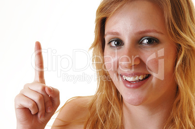 Smiling girl pointing finger. Smiling girl pointing finger.