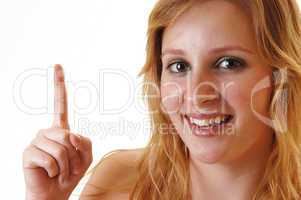 Smiling girl pointing finger.