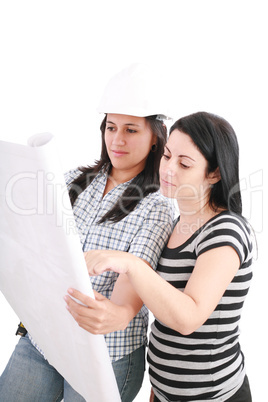 Attractive young engineer with helmet studying planes with her c