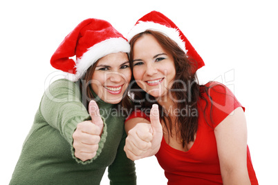 happy young Christmas girls make a sign OK