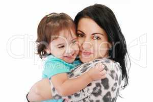 little girl hugging to mother, in her arms