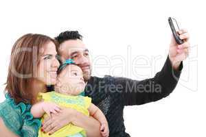 Closeup of happy family smiling over white background taking sel
