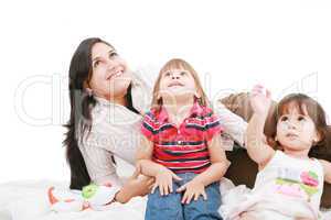 Happy caucasian mother and two daughter playing and looking up