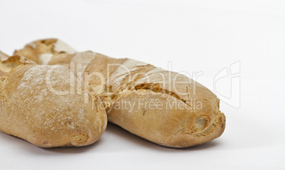 two baguettes on light background