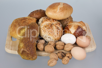 gem, nuts and eggs on a wooden board