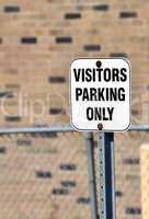 Visitors parking sign.