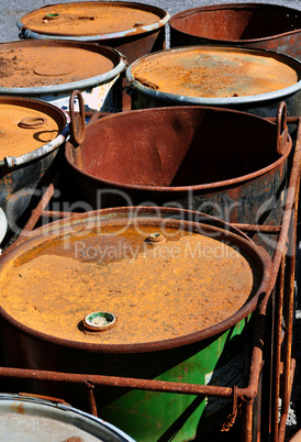 Old rusty waste barrels.