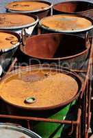 Old rusty waste barrels.