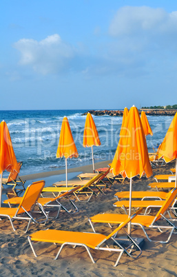 Sunbeds and beach umbrellas. Sunbeds and beach umbrellas.