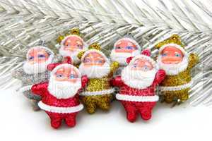 Some dolls of Santa Claus are together