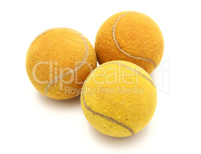 Three old tennis balls on a white background Three old tennis balls on a white background
