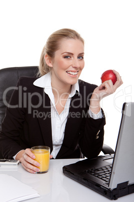 woman eating apple and drinking orange juice