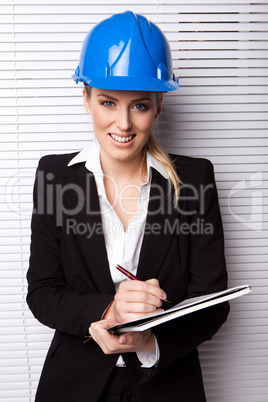 Smiling Businesswoman in Hard Hat Smiling Businesswoman in Hard Hat