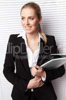 Attractive Blonde Businesswoman With File
