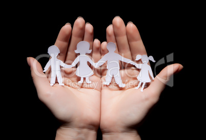 Paper chain family protected in cupped hands