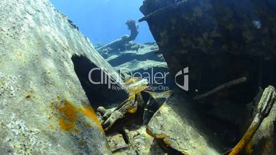 POV of a scuba diver exploring a shipwreck