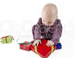 young child unpacking presents