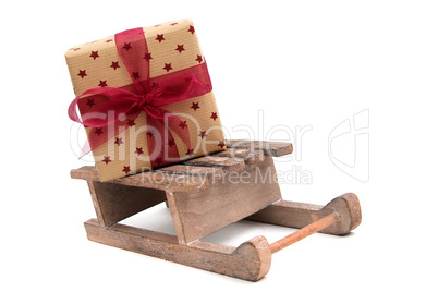 christmas gift on wooden sledge