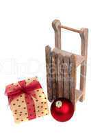 old wooden sledge with present on white