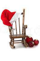 old wooden rocking Chair with red jelly bag cap