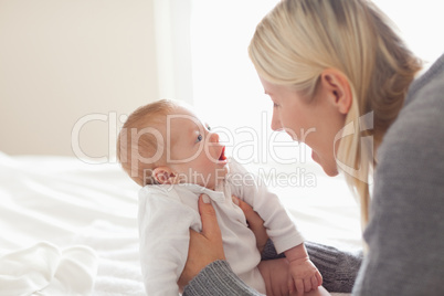 Affectionate mom holding her newborn