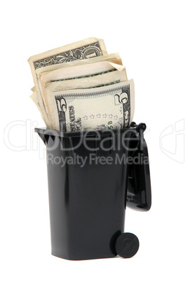 bank notes in black rubbish bin on white