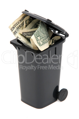 dollar notes in black rubbish bin on white