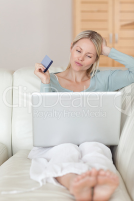 Woman on the sofa shopping online