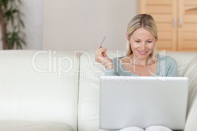 Woman shopping online on the sofa