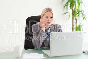 Businesswoman sitting behind her desk