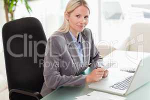 Side view of businesswoman doing her accounting