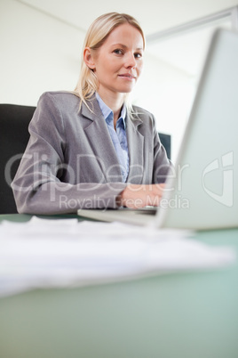 Businesswoman working on her notebook