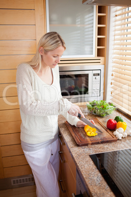 Side view of woman preparing vegetables