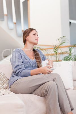 Portrait of a woman watching TV