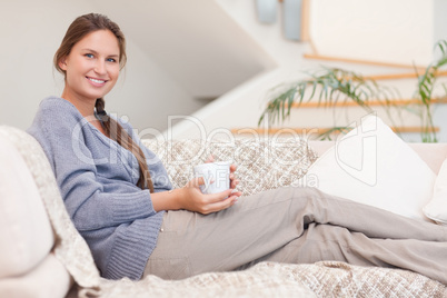 Beautiful woman holding a cup of tea