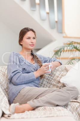 Portrait of a calm woman holding a cup of tea
