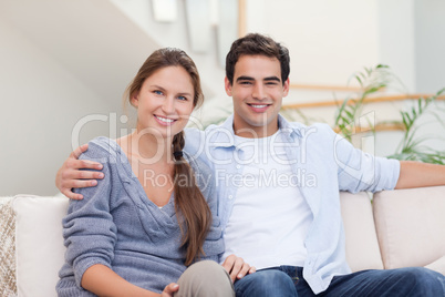 Couple posing in their living room