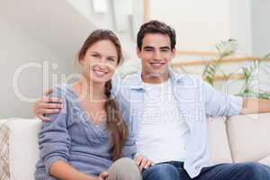 Couple posing in their living room