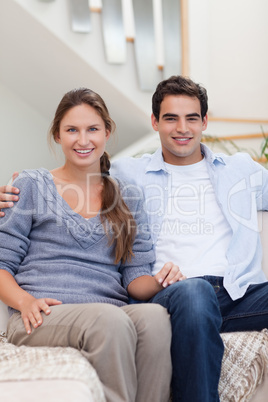 Portrait of a couple sitting on a sofa