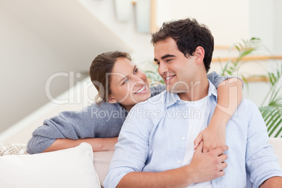 Smiling couple hugging