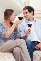 Portrait of a couple having a glass of red wine