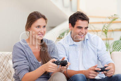 Young couple playing video games