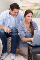 Portrait of a couple using a notebook