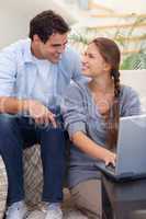 Portrait of an in love couple using a notebook