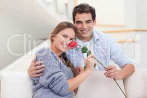 Young man offering a rose to his girlfriend