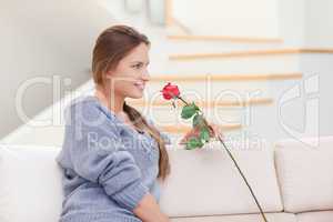 Woman posing with a rose