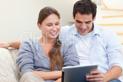 Young couple using a tablet computer