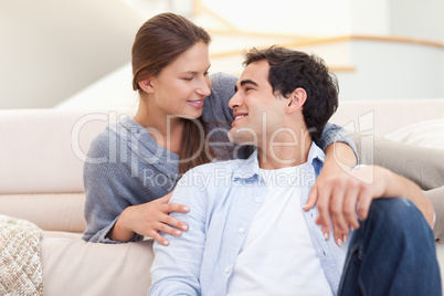 Young couple sitting in their living room