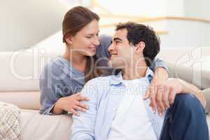 Young couple sitting in their living room